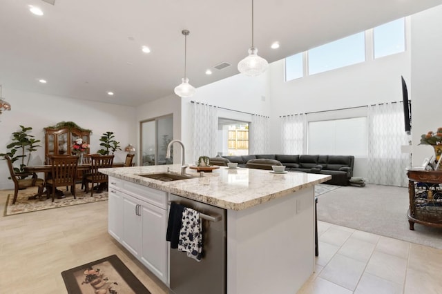 4693 Del Oro Rd, Madera, CA 93636 - kitchen with dishwasher, an island with sink, open floor plan, light stone countertops, and recessed lighting