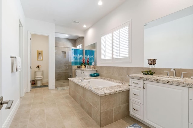 4693 Del Oro Rd, Madera, CA 93636 - full bath with vanity, a stall shower, a garden tub, tile patterned floors, and recessed lighting