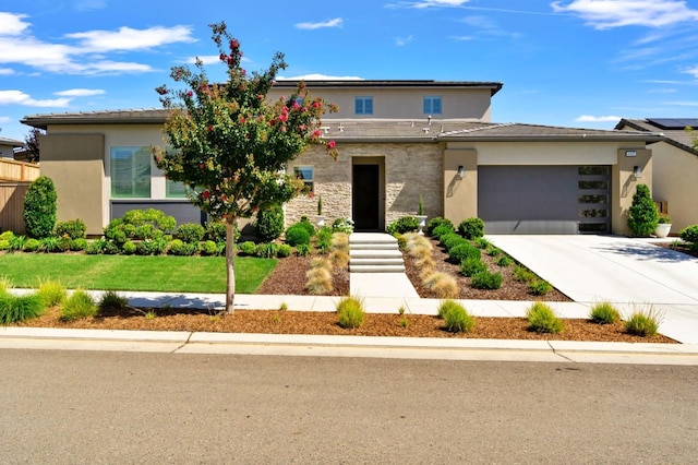 4693 Del Oro Rd, Madera, CA 93636 - view of front of home with stucco siding, driveway, an attached garage, and a front yard