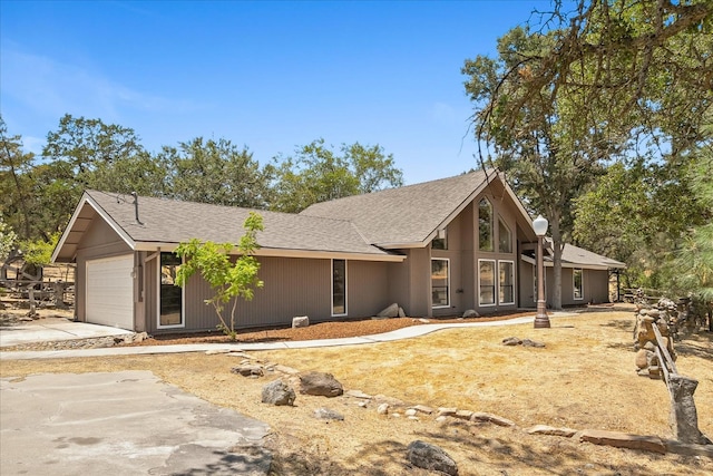 42617 John Muir Dr, Coarsegold, CA 93614 - mid-century inspired home featuring concrete driveway, an attached garage, and a shingled roof