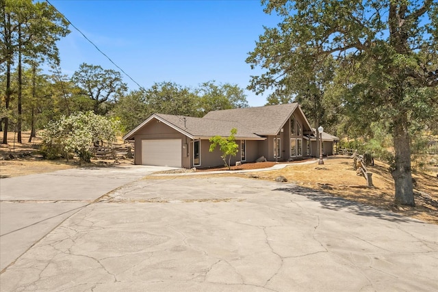 42617 John Muir Dr, Coarsegold, CA 93614 - view of front of property featuring concrete driveway and an attached garage
