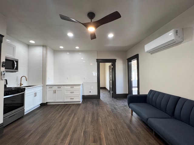 345 N Van Ness Ave, Fresno, CA 93701 - living area featuring a wall mounted air conditioner, dark wood finished floors, ceiling fan, and recessed lighting