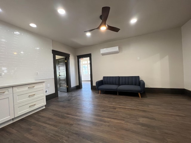 345 N Van Ness Ave, Fresno, CA 93701 - sitting room featuring a wall unit AC, a ceiling fan, dark wood finished floors, and recessed lighting