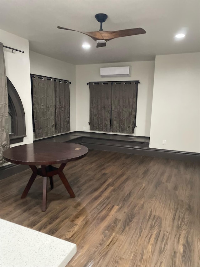 345 N Van Ness Ave, Fresno, CA 93701 - unfurnished living room with a barn door, wood finished floors, a ceiling fan, recessed lighting, and a wall mounted AC
