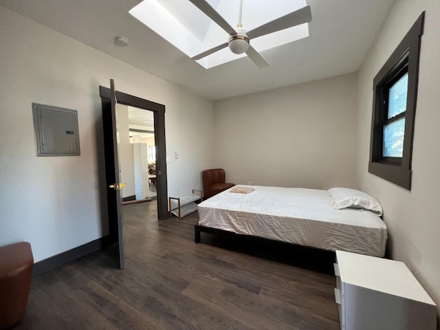 345 N Van Ness Ave, Fresno, CA 93701 - bedroom featuring electric panel, a skylight, dark wood-style flooring, and a ceiling fan