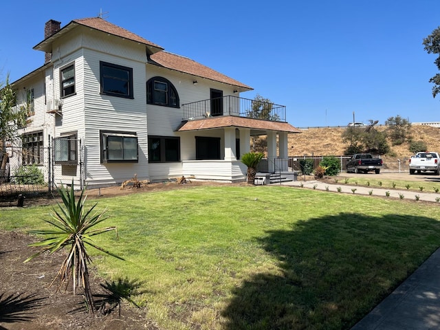345 N Van Ness Ave, Fresno, CA 93701 - back of house featuring a balcony, a chimney, and roof with shingles