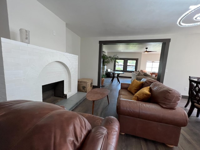 345 N Van Ness Ave, Fresno, CA 93701 - living area featuring wood finished floors, a ceiling fan, and a brick fireplace