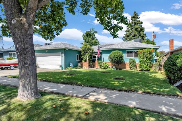 4653 N Fisher St, Fresno, CA 93726 - ranch-style home featuring a front lawn, a garage, stucco siding, driveway, and roof with shingles