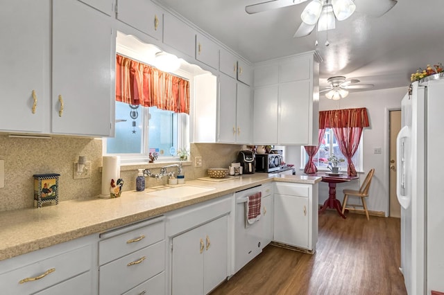 4653 N Fisher St, Fresno, CA 93726 - kitchen with white appliances, ceiling fan, tasteful backsplash, dark wood finished floors, and white cabinetry