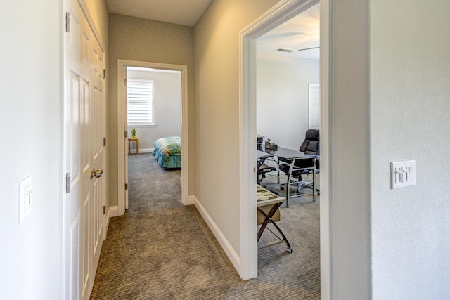 2286 N Janice Ave, Fresno, CA 93737 - corridor with dark colored carpet and baseboards