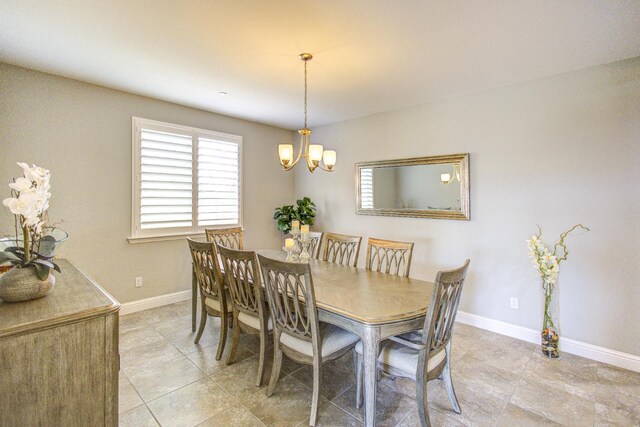 2286 N Janice Ave, Fresno, CA 93737 - dining space with light tile patterned floors, plenty of natural light, and a chandelier