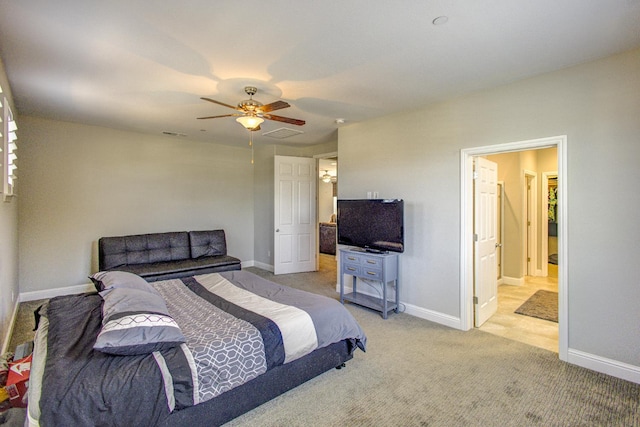 2286 N Janice Ave, Fresno, CA 93737 - bedroom with carpet floors, ceiling fan, and connected bathroom