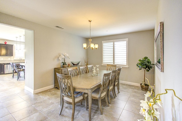 2286 N Janice Ave, Fresno, CA 93737 - dining space with a chandelier and light tile patterned floors