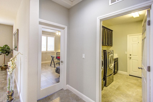 2286 N Janice Ave, Fresno, CA 93737 - corridor featuring washer and dryer and light tile patterned flooring