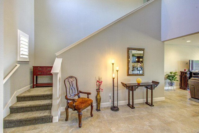 2286 N Janice Ave, Fresno, CA 93737 - staircase featuring a towering ceiling and baseboards