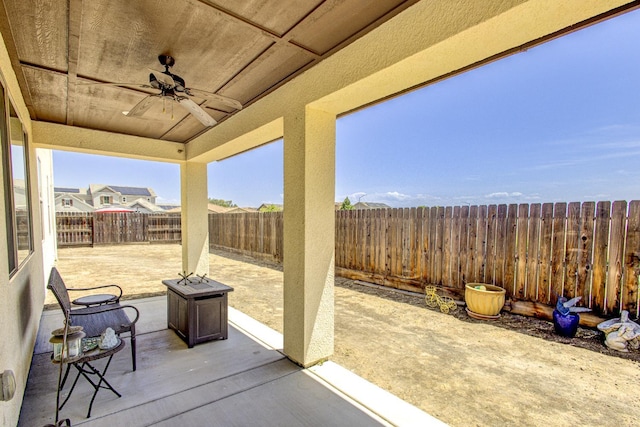 2286 N Janice Ave, Fresno, CA 93737 - fenced backyard featuring a ceiling fan and a patio area