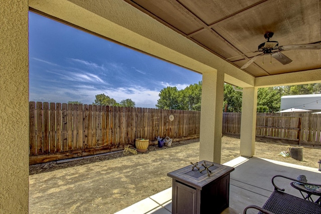 2286 N Janice Ave, Fresno, CA 93737 - fenced backyard featuring ceiling fan and a patio area
