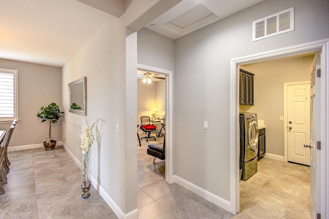 2286 N Janice Ave, Fresno, CA 93737 - hall featuring light tile patterned floors and washing machine and dryer