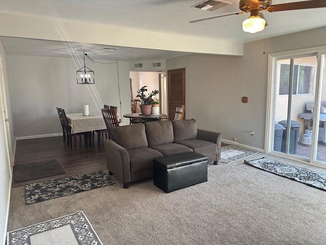 5509 E Crescent Ave, Fresno, CA 93727 - carpeted living area featuring ceiling fan and a chandelier