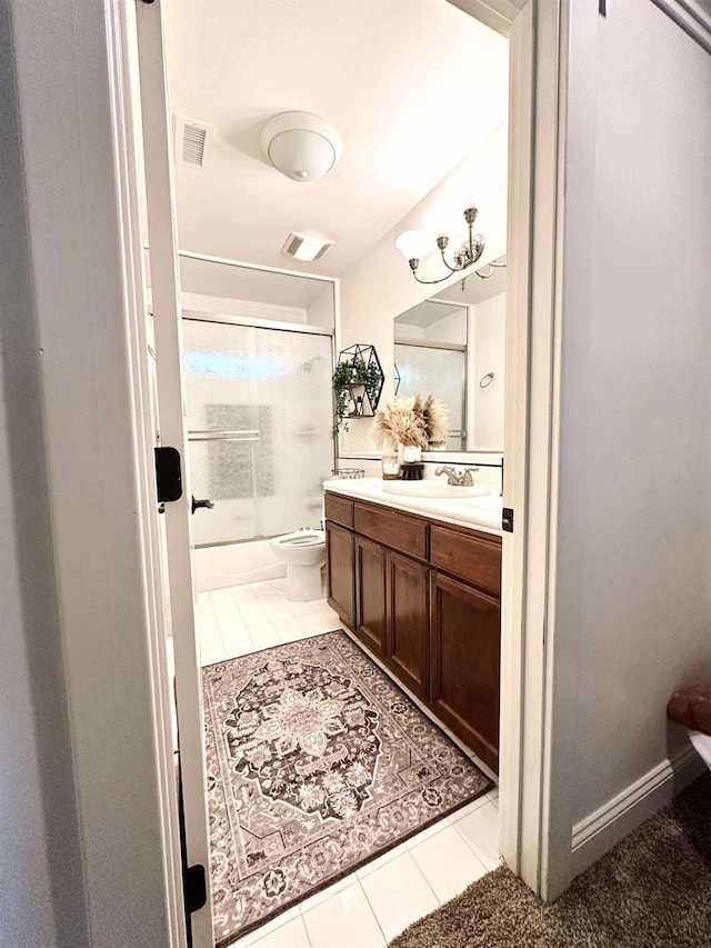 3728 E Huntington Blvd, Fresno, CA 93702 - bathroom with tile patterned floors, vanity, and combined bath / shower with glass door
