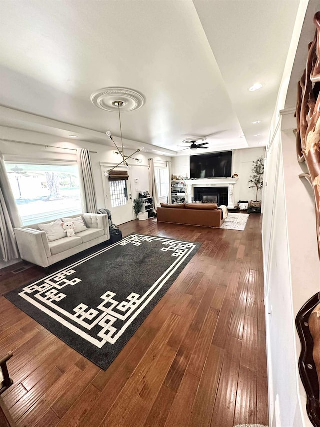 3728 E Huntington Blvd, Fresno, CA 93702 - living room with a glass covered fireplace, wood-type flooring, and ceiling fan