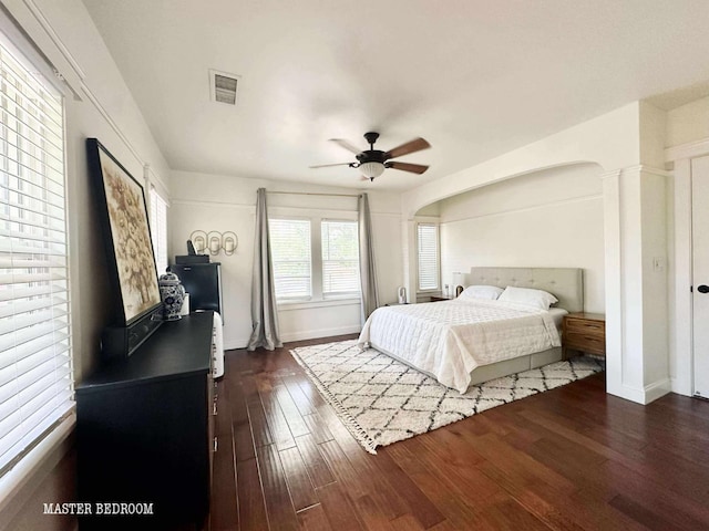 3728 E Huntington Blvd, Fresno, CA 93702 - bedroom with dark wood finished floors, arched walkways, and ceiling fan