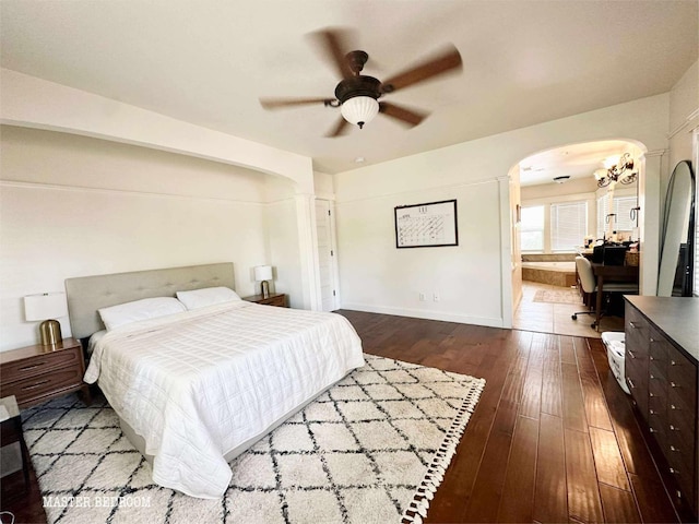 3728 E Huntington Blvd, Fresno, CA 93702 - bedroom with arched walkways, dark wood-type flooring, a ceiling fan, and a chandelier