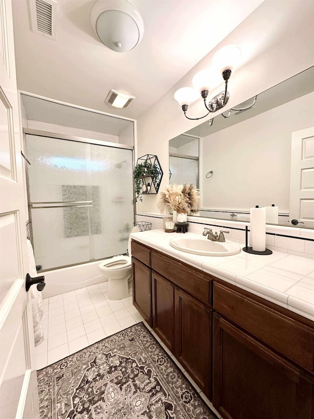 3728 E Huntington Blvd, Fresno, CA 93702 - bathroom with vanity, enclosed tub / shower combo, and tile patterned flooring