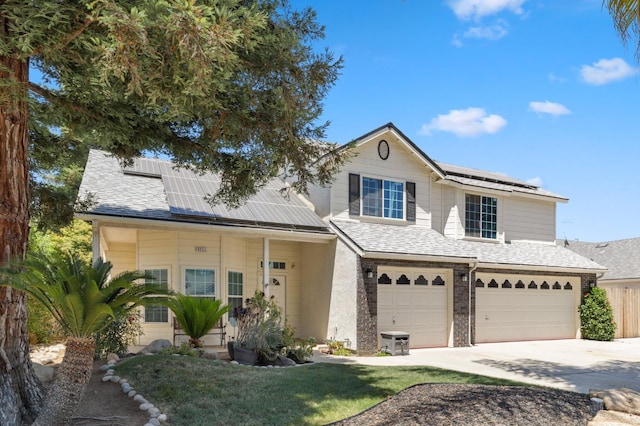 2111 Birch Ave, Clovis, CA 93611 - view of front of house featuring roof mounted solar panels, a garage, driveway, a front lawn, and a shingled roof