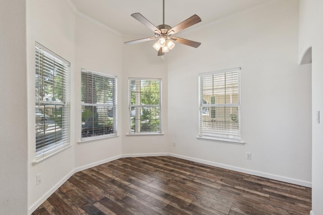 2111 Birch Ave, Clovis, CA 93611 - unfurnished room featuring dark wood-style flooring, ceiling fan, ornamental molding, and a towering ceiling