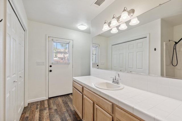 2111 Birch Ave, Clovis, CA 93611 - bathroom with a closet, wood finished floors, vanity, and a shower