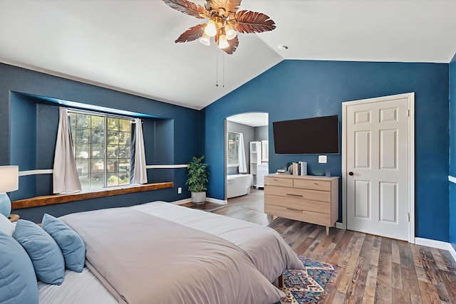 2111 Birch Ave, Clovis, CA 93611 - bedroom with vaulted ceiling, hardwood / wood-style flooring, ceiling fan, and arched walkways