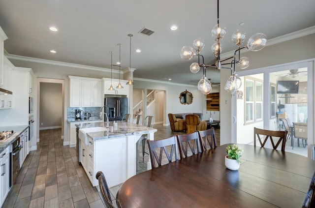 3211 Salem Ave, Clovis, CA 93619 - dining room with ornamental molding, recessed lighting, a ceiling fan, and stairway