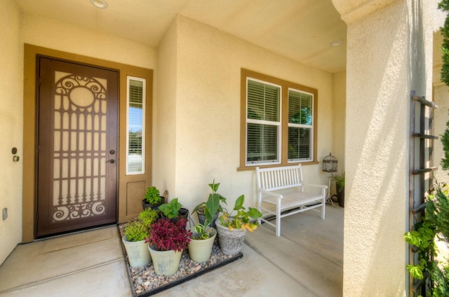 3211 Salem Ave, Clovis, CA 93619 - doorway to property with stucco siding and a porch