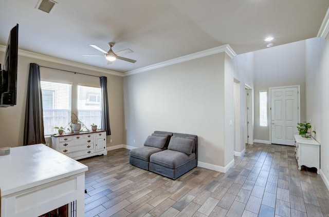 3211 Salem Ave, Clovis, CA 93619 - living area with ceiling fan, crown molding, and light wood finished floors