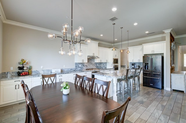 3211 Salem Ave, Clovis, CA 93619 - dining space featuring crown molding, light wood-type flooring, and recessed lighting