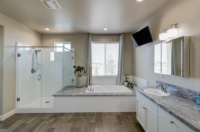 3211 Salem Ave, Clovis, CA 93619 - bathroom with a garden tub, vanity, a shower stall, wood finished floors, and recessed lighting