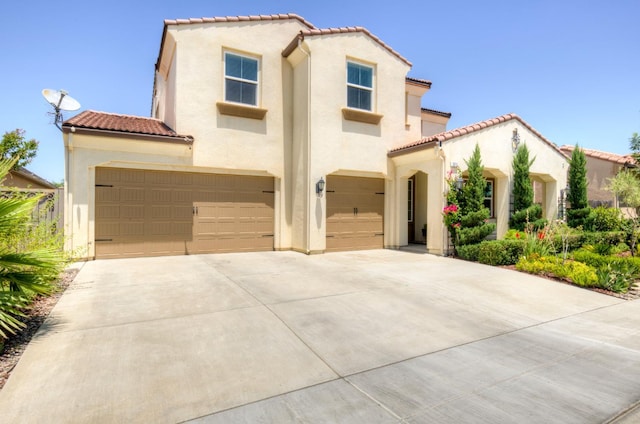 3211 Salem Ave, Clovis, CA 93619 - mediterranean / spanish-style home with a tiled roof, an attached garage, stucco siding, and concrete driveway