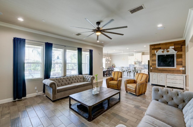 3211 Salem Ave, Clovis, CA 93619 - living area featuring a ceiling fan, crown molding, recessed lighting, and light wood-style flooring