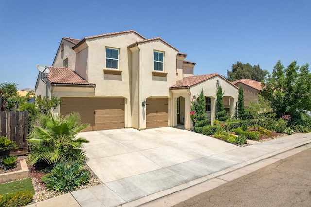 3211 Salem Ave, Clovis, CA 93619 - mediterranean / spanish-style house featuring a tiled roof, an attached garage, stucco siding, and driveway