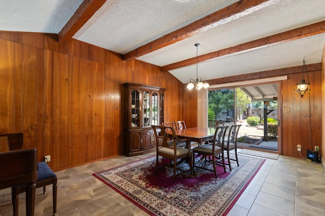 1432 E Holland Ave, Fresno, CA 93704 - dining area featuring wood walls, a textured ceiling, and a chandelier