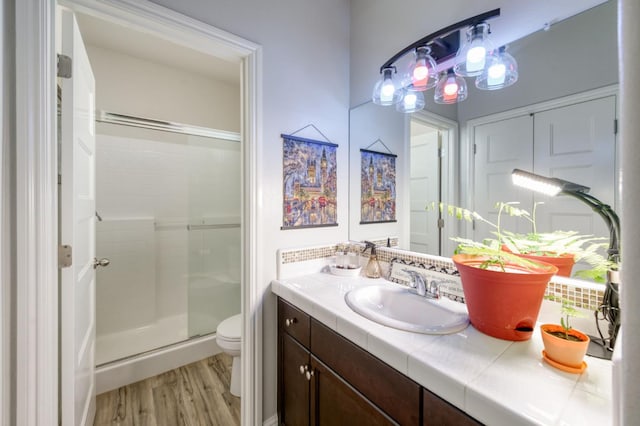 3562 Luminary Way, Clovis, CA 93619 - full bathroom featuring vanity, a shower stall, and wood finished floors