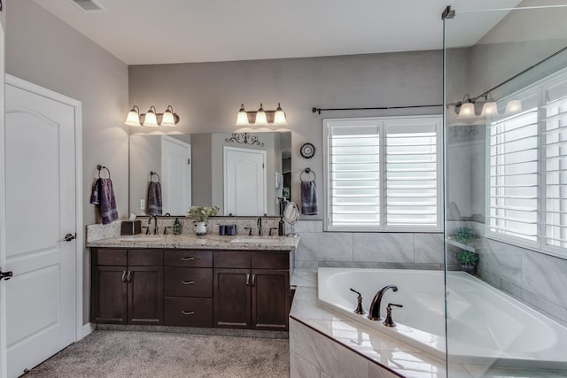 1966 Decatur Ave, Clovis, CA 93611 - full bathroom with healthy amount of natural light, double vanity, and a bath