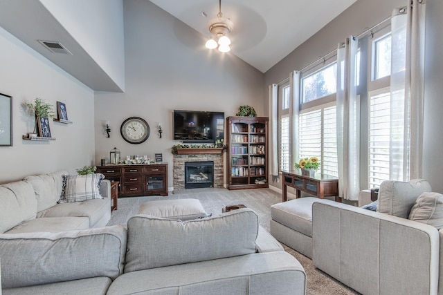 1966 Decatur Ave, Clovis, CA 93611 - living area with light colored carpet, a ceiling fan, a fireplace, and high vaulted ceiling