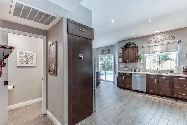 1966 Decatur Ave, Clovis, CA 93611 - kitchen with dishwasher, light wood-style floors, dark brown cabinets, healthy amount of natural light, and recessed lighting