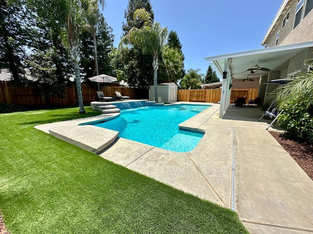 1966 Decatur Ave, Clovis, CA 93611 - view of pool featuring ceiling fan, a storage unit, a fenced backyard, and a patio