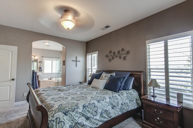 1966 Decatur Ave, Clovis, CA 93611 - carpeted bedroom with arched walkways, connected bathroom, and ceiling fan