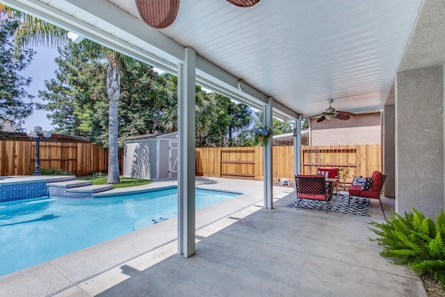 1966 Decatur Ave, Clovis, CA 93611 - view of swimming pool featuring ceiling fan, a patio, a fenced backyard, and a storage shed