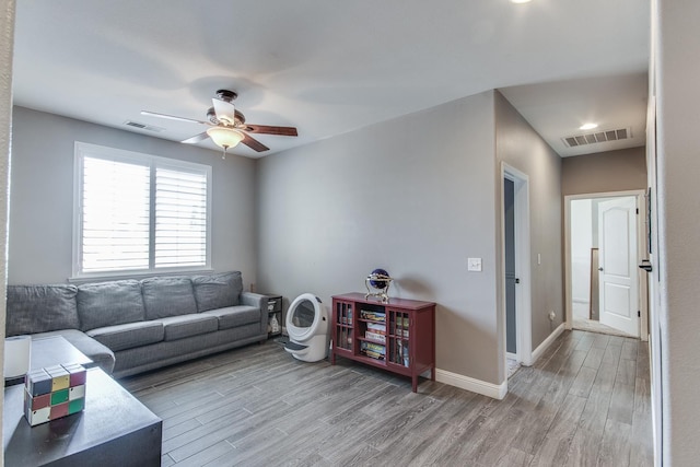1966 Decatur Ave, Clovis, CA 93611 - living area with a ceiling fan and light wood-style flooring
