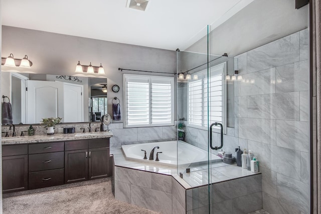 1966 Decatur Ave, Clovis, CA 93611 - full bathroom with double vanity, a garden tub, and a stall shower